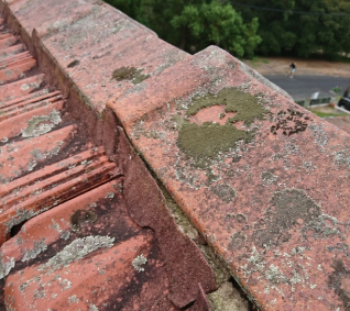 Photo of a stone roof with mild cracks and blemishes